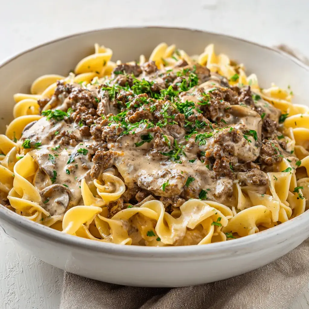 easy ground beef stroganoff saved my Tuesday night. I’d promised dinner by six, the dog stole my spatula