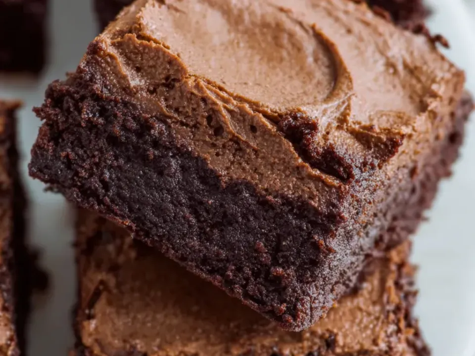 Thick fudgy brownie squares with a crackled dark crumb, topped with a thick swirled layer of light chocolate mousse